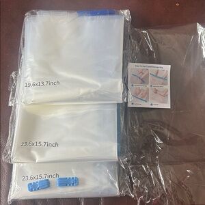Set of Clear Reusable Vacuum Storage Bags with Blue Clips